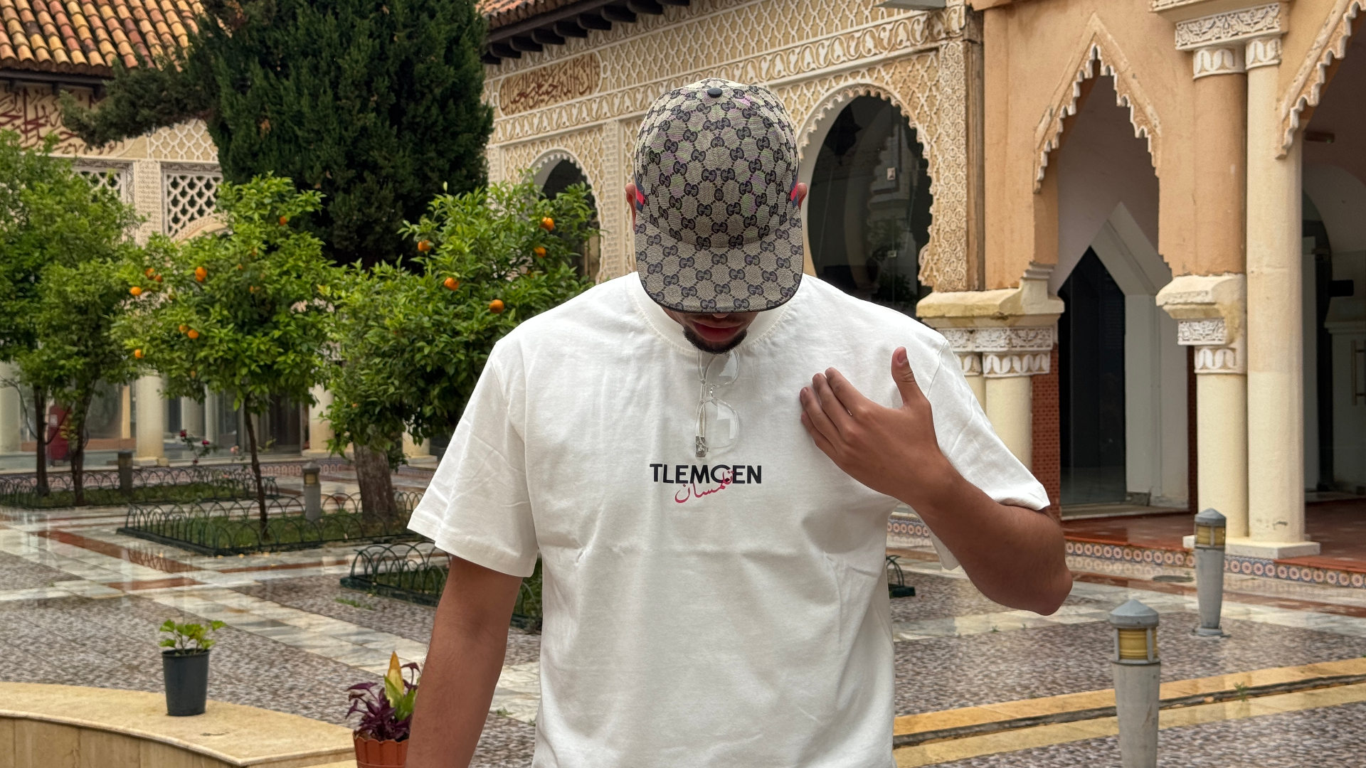 Tlembrand cover — Tlemcen tee in heritage courtyard